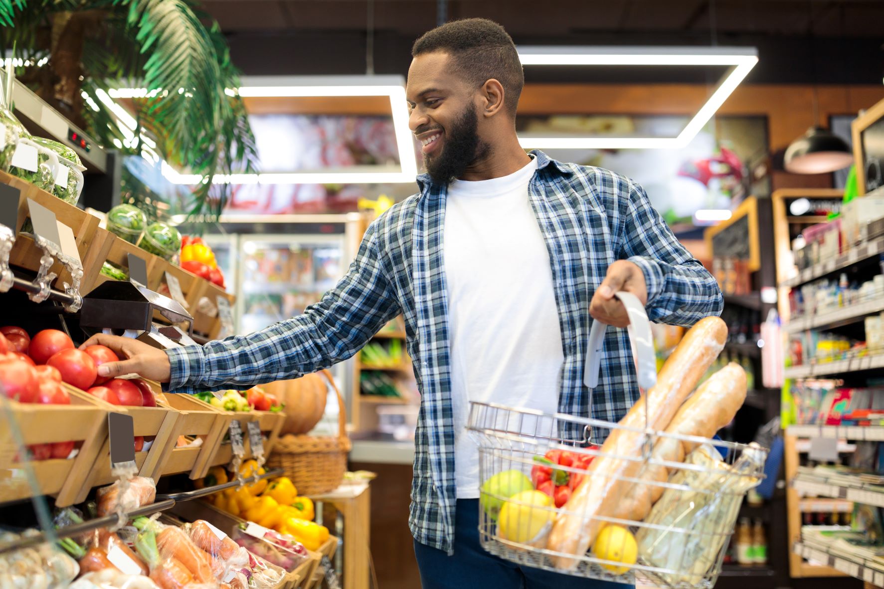 african american man grocery shopping in supermarket